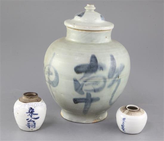 A Chinese blue and white calligraphic jar and cover, and two similar smaller jarlets